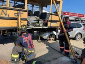 Firefighters performing safety training with a school bus. Photo Courtesy of the Fairfield Regional Fire School